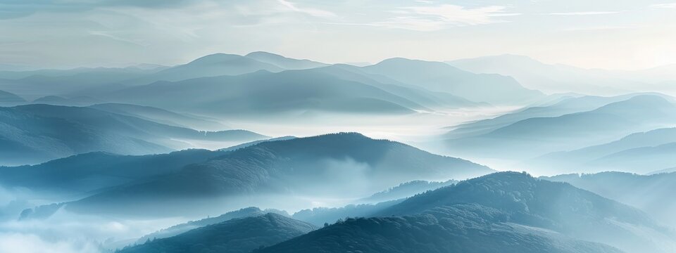 A serene mountain landscape at dawn, with mist rolling over gentle slopes.