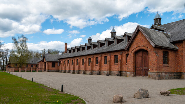 Zagare manor red brick stables on a sunny spring day, Lithuania
