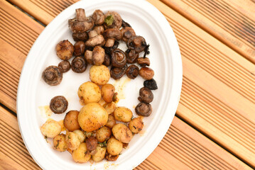 Baked potatoes and mushrooms on a plate