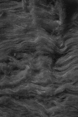 black mineral wool with a visible texture