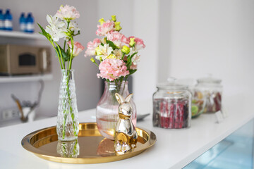 Elegant home decor with flowers and gold accents