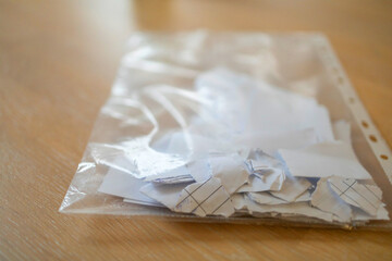 Torn contract in plastic pocket - obrazy, fototapety, plakaty