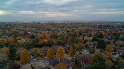 Foto op Canvas An aerial view of a colorful Suburban Town in the fall © Matt