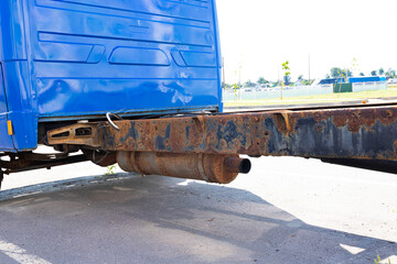 Rusty muffler and exhaust pipe of a truck.