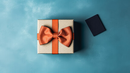 A gift box with a bow on top of it