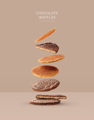 Creative layout made of chocolate stroopwafel on beige background. Flat lay. Food concept. Macro ...