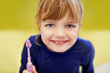 Girl, portrait or kid in home brushing teeth with smile or development or morning routine in bathroom. Face, learning or happy child cleaning mouth with toothbrush for dental, wellness or oral health
