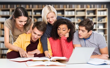 Group of smiling students study together