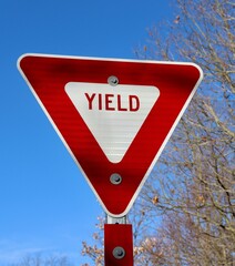 A close view of the red yield sign.