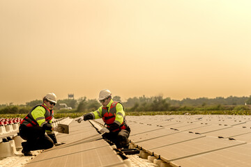 Photovoltaic engineers work on floating photovoltaics. workers Inspect and repair the solar panel equipment floating on water. Engineer working setup Floating solar panels Platform system on the lake.