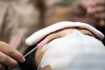 Beautiful  woman eyelash extension Inside a beauty salon in Thailand