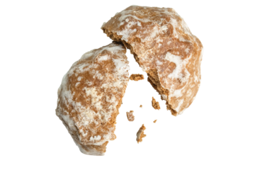 Gingerbread is broken in half with crumbs scattered. Isolation on a transparent background.