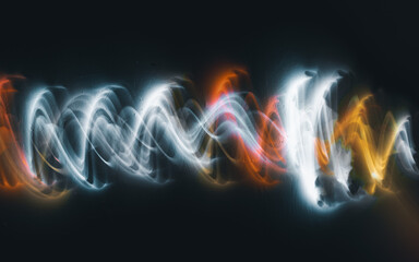 abstract irregular Light waves on black background. Long exposure. Light painting photography.
