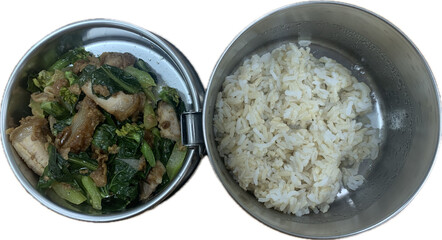 Stir fried kale with crispy pork in oyster sauce and brown Thai jasmine rice in Thai lunch box, pin to, isolated on white background 