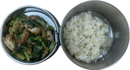 Stir fried kale with crispy pork in oyster sauce and brown Thai jasmine rice in Thai lunch box, pin to, isolated on white background 