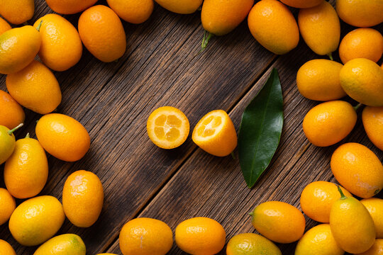 Still life of ripe kumquat fruits. Kumquat fruit top view. Background from ripe kumquat. Many kumquat fruits.