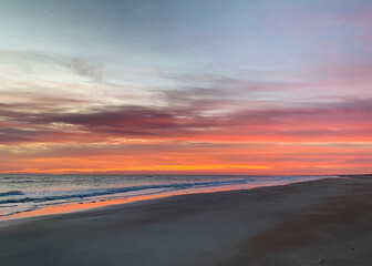 Pink and orange sunrise over St. Augustine Beach and the Atlantic Ocean