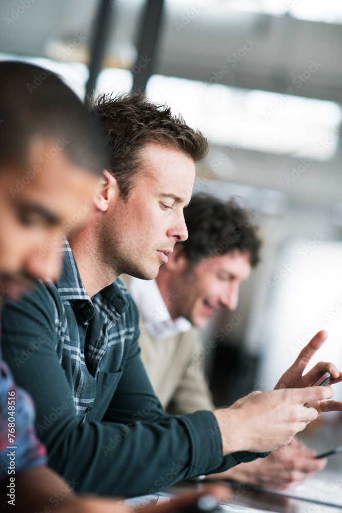 Poster Typing, man and meeting in office with phone research or communication of project with notes in email. Professional, team and person planning schedule with smartphone or reading information online