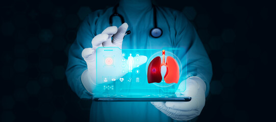 The doctor shows a hologram of the lungs on his tablet. Concept of development of new technologies...