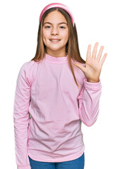 Beautiful brunette little girl wearing casual turtleneck sweater showing and pointing up with fingers number five while smiling confident and happy.