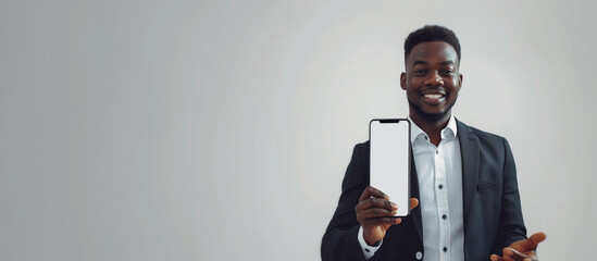 Business App. Black Young Businessman Holding Big Blank Smartphone In Hand, Smiling Male African American Entrepreneur Demonstrating White Phone Screen, Recommending Mobile Application, Mockup - obrazy, fototapety, plakaty