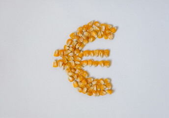 Euro symbol. Corn. Grain. White background. European Union agriculture trade policies. Transit ban...