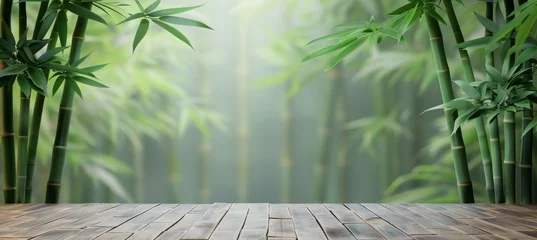 Poster Tranquil bamboo forest and green meadow in soft focus with sunlight filtering through green leaves © Ilja