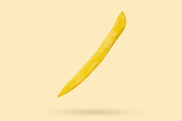  French fries isolated on yellow background © Piman Khrutmuang