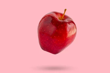  Fresh red apple isolated on pink background © Piman Khrutmuang