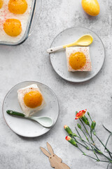 Homemade German Fried Egg Cake Spiegeleierkuchen (Spiegeleiertorte) with apricot and coconut milk pudding. Traditional Easter Dessert. Festive Easter food.