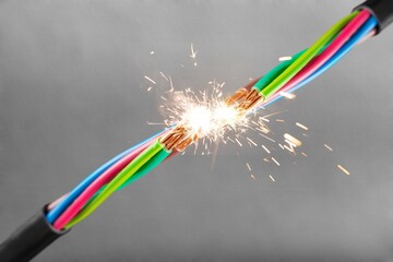 Sparks explosion at electrical cables hazard concept