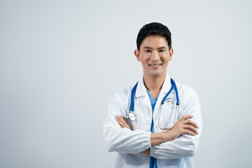 Portrait of a young  man doctor on a white background.
