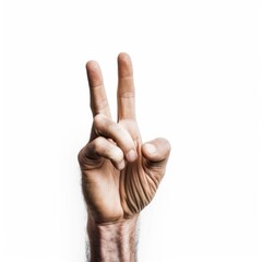 A hand making a peace sign