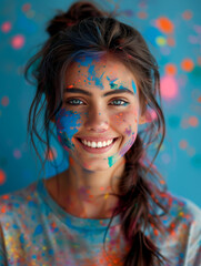 Naklejka premium Euphoric expression: a smiling face in vibrant Holi paint