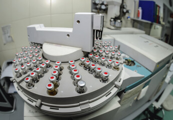 Sample vials on Gas Chromatograph autosampler in a police forensic laboratory in Warsaw city, Poland