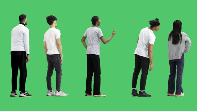 A group of people on a green background in full-length view from the back are waiting