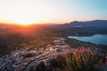 Aerial view of Zahara de la Sierra city at sunset - Zahara de la Sierra, Cadiz Province, Andalusia, Spain - obrazy, fototapety, plakaty