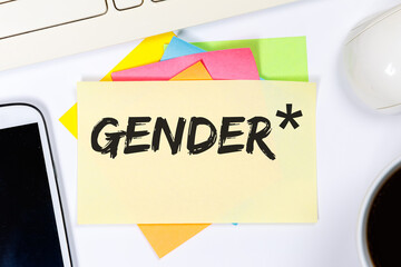 Gendern mit Gendersternchen als Symbol für gendergerechte Sprache Kommunikation Konzept auf Schreibtisch - 768099981