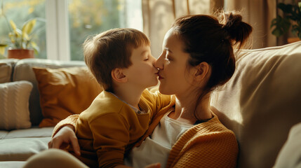 A cozy scene in a living room with a mother cuddled up on the sofa with her little boy, whispering a kiss on his nose, the soft shadows and gentle light from the room creating a pe