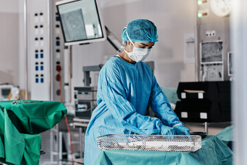 Doctor, table and emergency in theater for healthcare with mask, getting ready and surgery...