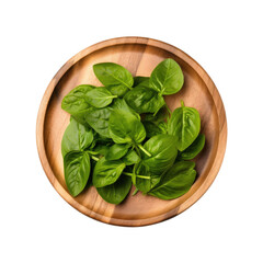 wooden round plate with fresh spinach leaves, isolated on a white background. top view