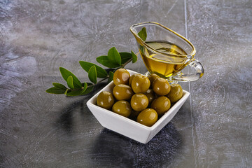 Ripe tasty green olives with branch