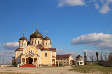 Fototapeta na wymiar A church with a cross on top