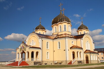 A large building with a gold roof with Alexander Nevsky Cathedral, Tallinn in the background