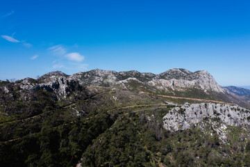 Aerial view of boats and beautiful city in Marmaris, Turkey. Landscape with boats in marina bay, sea, city lights, mountains. Top view from drone. 