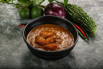 Indian cuisine - chicken curry with spices