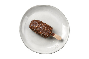 chocolate ice cream ice cream on a stick in a plate, cut out, top view