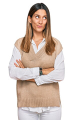 Young woman wearing casual clothes smiling looking to the side and staring away thinking.