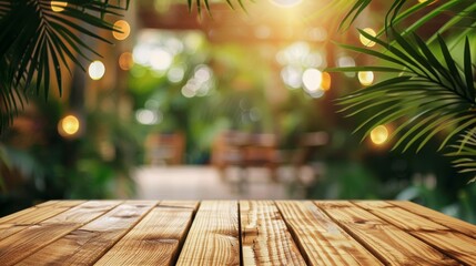 Wooden table on blur background with palm tree, jungle or tropical cafe
