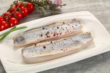 Marinated herring fillet with green onion